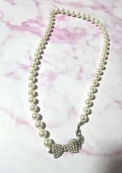 パールホワイト リボンモチーフ ネックレス