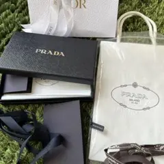 最終お値下げ新品未使用PRADA 黒フラグメントケース 白ショッパーディオール