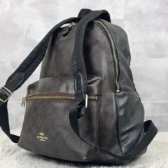 コーチ PVC リュック ロゴ型押し ファスナー シグネチャー ブラウン