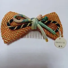 オレンジと金色のリボン型髪飾り