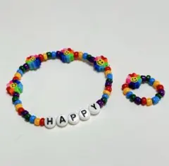 カラフルビーズ ブレスレットと、指輪HAPPY 虹とニコちゃん　ハンドメイド