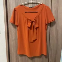 Reflect オレンジ リボン付き トップスのサムネイル