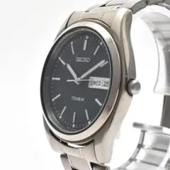 Non-working SEIKO men's titanium day-date watch with black dial.