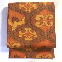 5k1615 名古屋帯　絹　真綿紬　橙色　茶色　柄物　和装　着物