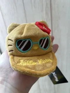大人気の日焼けキティ キャップ型コインケース