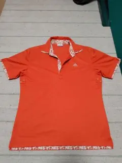 モーすぐ春　adidas オレンジ ポロシャツ 花柄襟