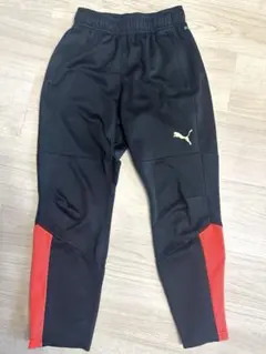 Puma スリムフィット ジャージ 黒/オレンジ　140