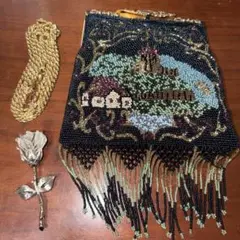 ビーズ織りパーティーバッグと銀？のバラと金？のネックレスのサムネイル