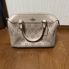 コーチ 花柄パンチングバッグ　ピンクベージュ