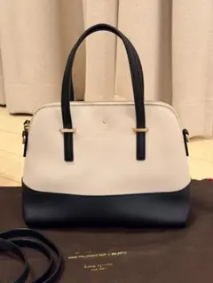 美品】kate spade 2wayバッグ アイボリー×黒 保存袋付 - メルカリ