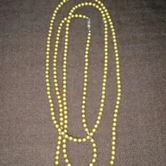 ゴールドのロングネックレス