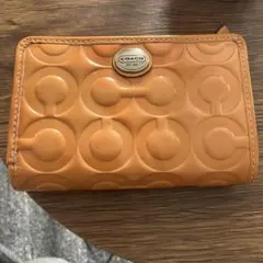 COACH エンボス加工 二つ折り財布 オレンジ