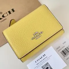 COACH コーチ　三つ折り財布　レトロイエロー　黄色　ミニウォレット