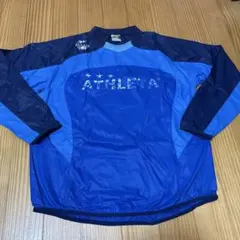 ATHLETA ピステ・ウィンドブレーカー 青Oサイズ プリント剥がれ有り