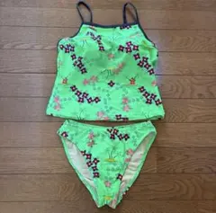 Women's two-piece swimsuit, lime green with a cute floral pattern, perfect for the pool, beach, or summer vacation.