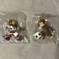 おさるのジョージ フィギュアマスコット 2種 スケート サッカー ガチャ