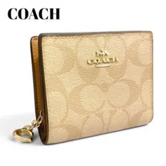 【極美品】COACH 二つ折り財布 シグネチャー 現行品 ベージュのサムネイル