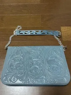 GRACE CONTINENTAL Carving Tribes クラッチバッグ