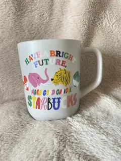 これは、スターバックスのリサイクルセラミックマグ（グレー、355ml）です。﻿