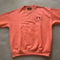 オレンジ クルーネック トレーナー