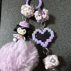 紫色のキャラクター付き携帯ストラップ