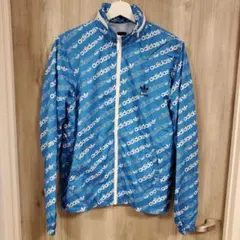 adidas アディダス 長袖 折畳みフード付き 総ロゴ柄ナイロンジャケット M