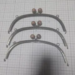 ガマ口金具、くし型、木玉、縫い付けタイプ。24.5センチ。