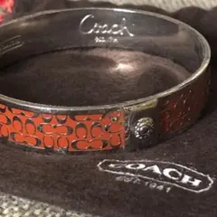 COACH コーチ ミニシグネチャー バングル ブレスレット シルバー×オレンジ