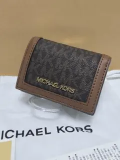 マイケルコースJET SETTRAVEL トライフォールド ジップウォレット新品