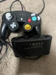 純正品ニンテンドー GCコン スマブラブラック と 純正品ではないGCコンタップ