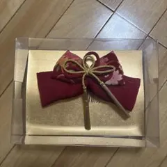 赤いリボンの髪飾り