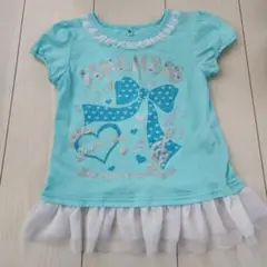 美品　西松屋エルフィンドール水色リボン音符プリントTシャツ 120のサムネイル