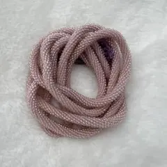 薄いピンクのビーズ帯締め