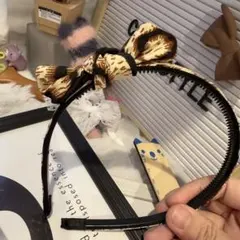 特売✴︎カチューシャコーナー035ワイルド雪豹柄レオパードリボンカチューシャ細め