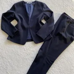 【美品】ナチュラルビューティベーシック パンツスーツ ノーカラー ネイビー Ｍ