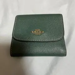 COACHのグリーン二つ折り財布