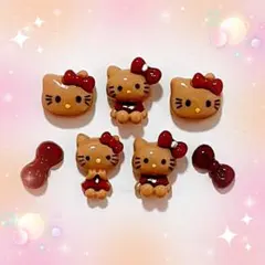 冬ネイル　キティ　キティちゃんパーツ　ネイルパーツ　ダークレッド　日焼け.。