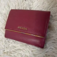 プラダ　PRADA 二つ折り財布　サフィアーノレザー　ピンク系　ロゴのサムネイル