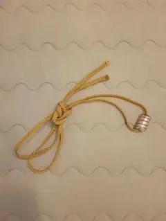 金色の帯留め・根付