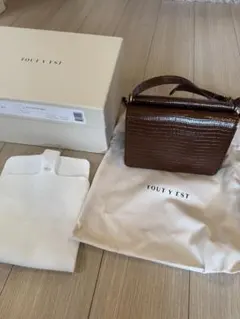 TOUT Y EST サックパウメル ミニ ブラウン 未使用 - メルカリ