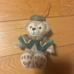 ダッフィー ぬいぐるみバッジ チェック柄ケープ