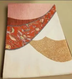 ​【リメイクに】名古屋帯 更紗文様 パッチワーク風 紬地 サーモンピンク系