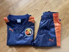 【未使用品】PUMA ピステ上下セット ネイビー/オレンジ　サイズ130
