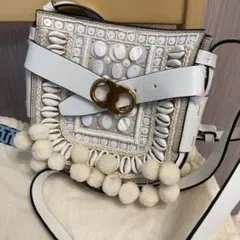 トリーバーチ／ホワイトレザーショルダーバッグ ポンポン付き