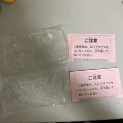 ファミコンソフトを入れるビニール2枚と注意書きの紙2枚