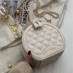 LA VORAGINE 丸いチェーンデザインショルダーバッグ クラッチバッグ