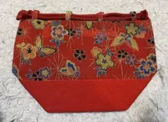 赤い花柄巾着型和装用バッグ