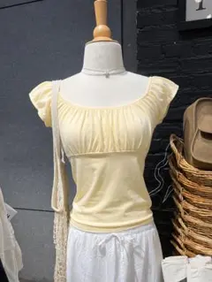 Brandy Melville ブラウス イエロー - メルカリ