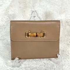 【GUCCI】ベージュ系　レザー　三つ折り財布　バンブー　がま口　ゴールド金具