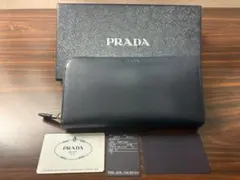箱・ギャランティカード付プラダラウンドファスナーサフィアーノレザー長財布ネイビー